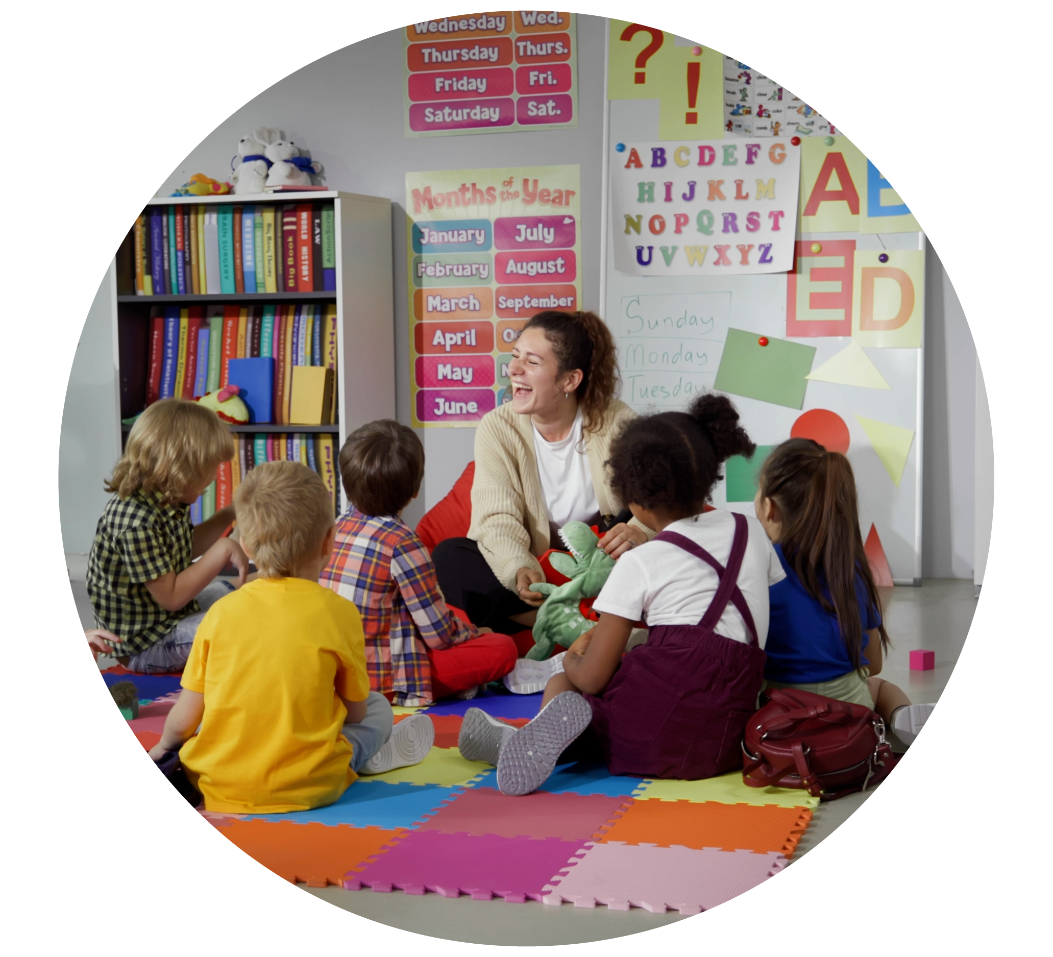 An image of a primary school teacher talking to a class of children. The image's link takes you to info on 'free' childcare for three and four-year-olds (and some younger), in our full guide about help with childcare costs.